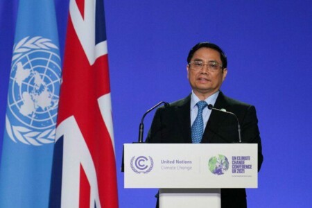 Vietnam's Prime Minister Pham Minh Chinh presents his national statement as part of the World Leaders' Summit of the COP26 UN Climate Change Conference in Glasgow, Scotland on November 1, 2021. - COP26, running from October 31 to November 12 in Glasgow will be the biggest climate conference since the 2015 Paris summit and is seen as crucial in setting worldwide emission targets to slow global warming, as well as firming up other key commitments. (Photo by Ian Forsyth / POOL / AFP)
